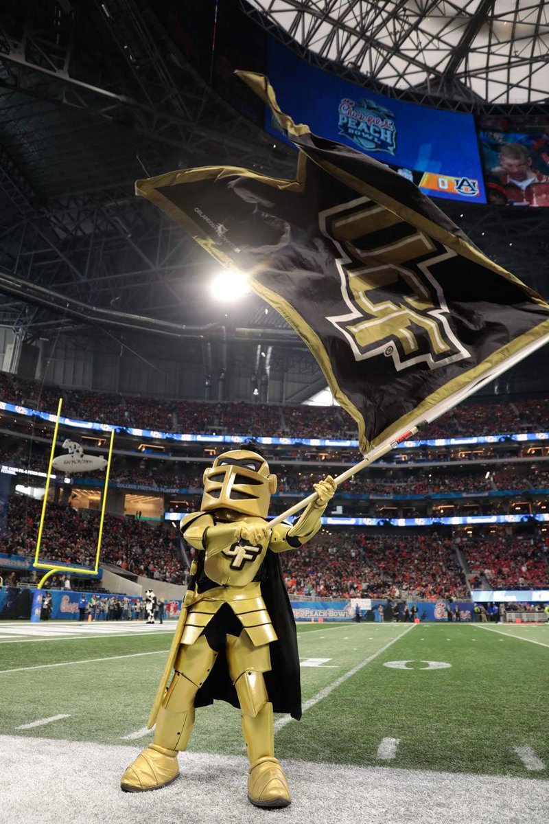 WoosterBrush's tweet photo. When you need some extra reach, you can always depend on Wooster Sherlock Extension Poles!  Here you see the University of Central Florida mascot, Knightro, waving his school colors with a Sherlock Extension Pole during the 2018 Chick-fil-A Peach Bowl. https://t.co/bDfDS59IEM https://t.co/gLPumyNQI2
