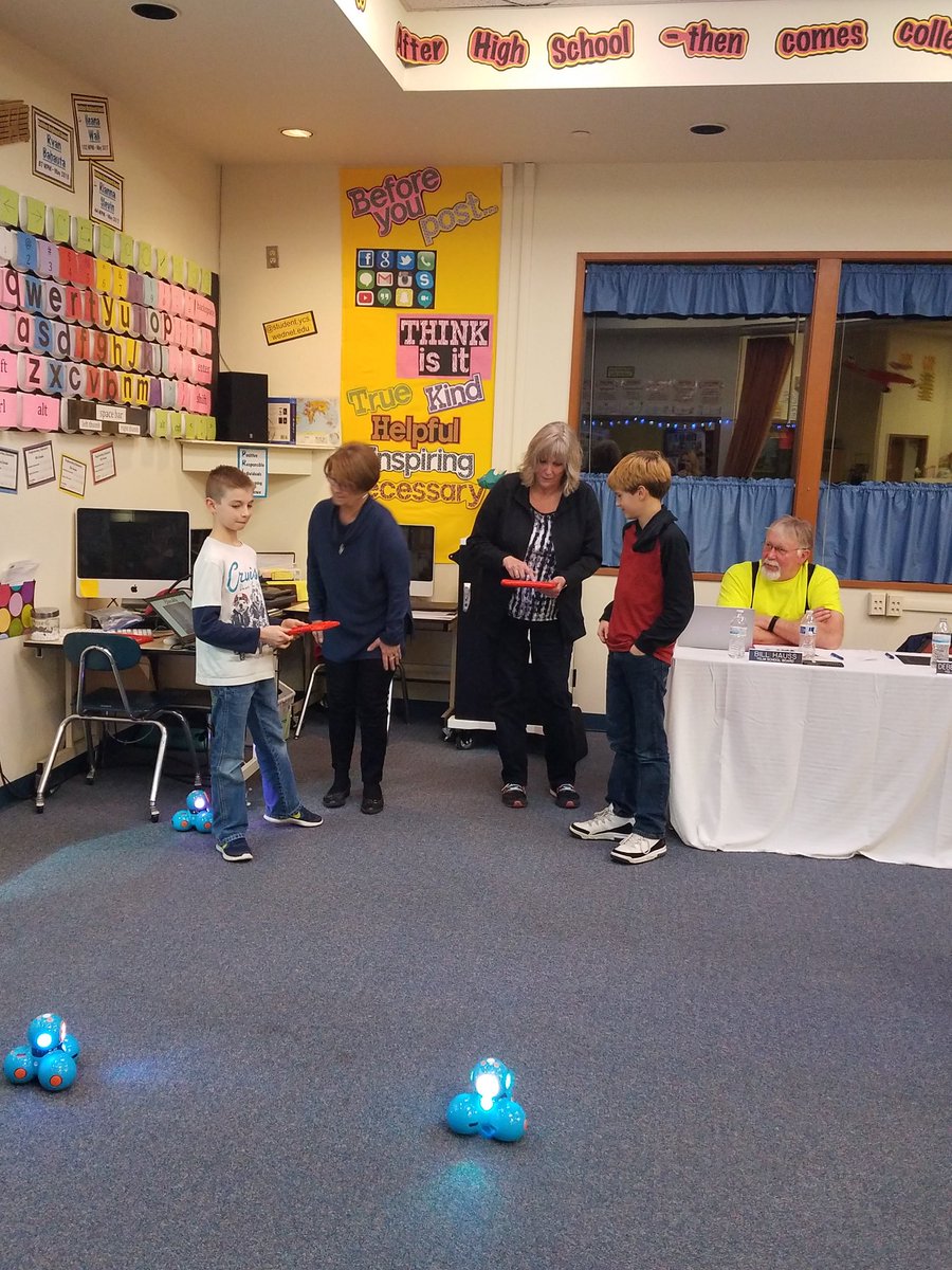 PrairiePanthers's tweet photo. Pretty proud of these two Prairie students teaching our school board how to code the dash robots https://t.co/SCrjwOhb3C
