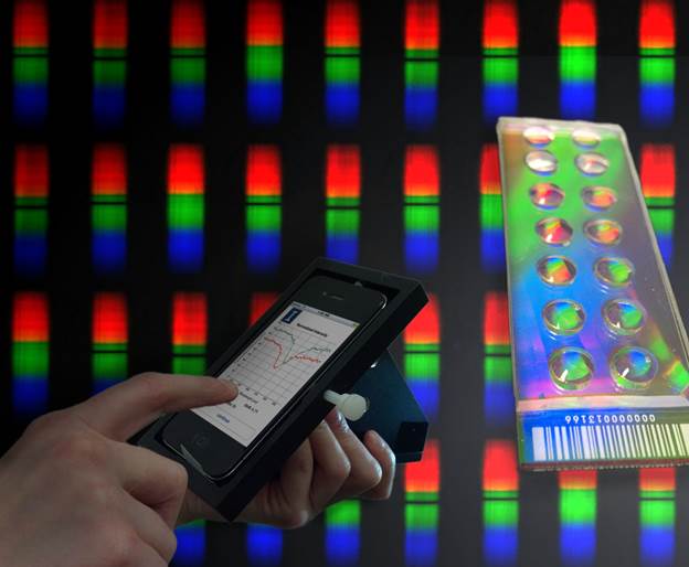 Biosensor_event's tweet photo. A student uses the smartphone application to compare wavelength shifts in two samples (foreground, left), measured with a PC-based biosensor (foreground, right). #BiosensorsCongress2018 #Bioelectronics #conferences #events #BionicHearing #Neurobionics #Biochips https://t.co/fATH5CBwEb