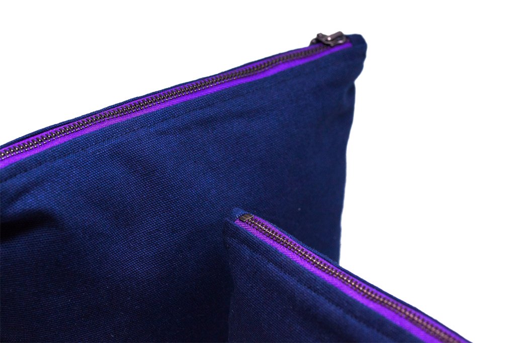 Navy blue with a pop of purple!  #awrmarket #aswerise #awrgoods #productswithpurpose #thoughtfuldesign #createopportunity #liftasyouclimb #webelongtoeachother #ethicalaccessoriess #workessentials #votewithyourdollars #votewithyourwallet #risetogether
