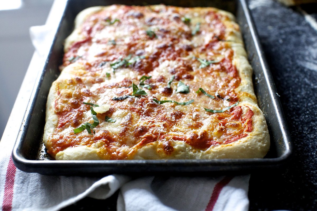 smittenkitchen's tweet photo. Rainy Fridays call for pizza, but the easy kind. This dough -- no kneading, machinery, or refrigeration required --  fits itself into your busy life (with three different schedule options), and not vice-versa, makes it a sure thing. Hallelujah. https://t.co/4FEZcrpVup https://t.co/8bBhvSUpZw