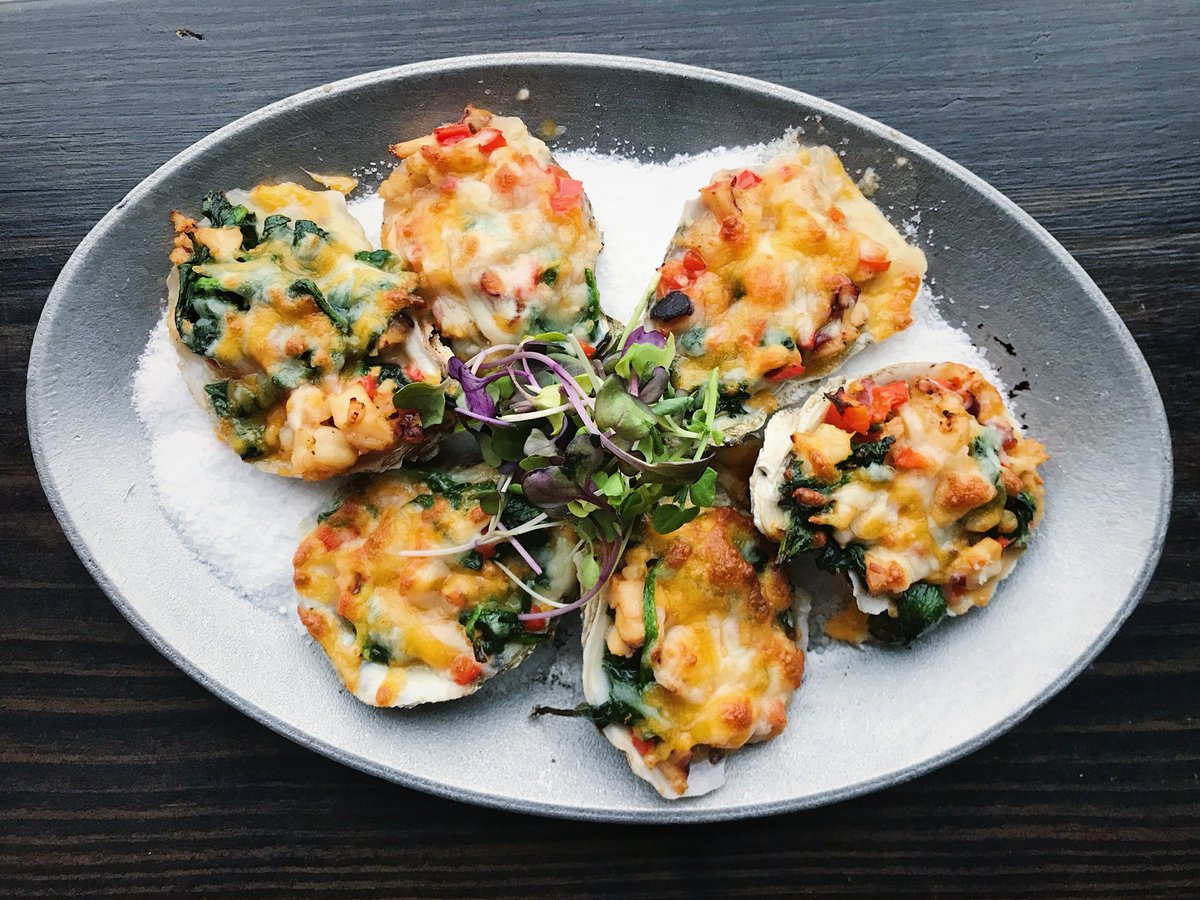 Cozy on up to tonight’s dinner special. 
Oysters gratin with sautéed garlic, spinach, shrimp, octopus, red peppers, and colby jack cheese.