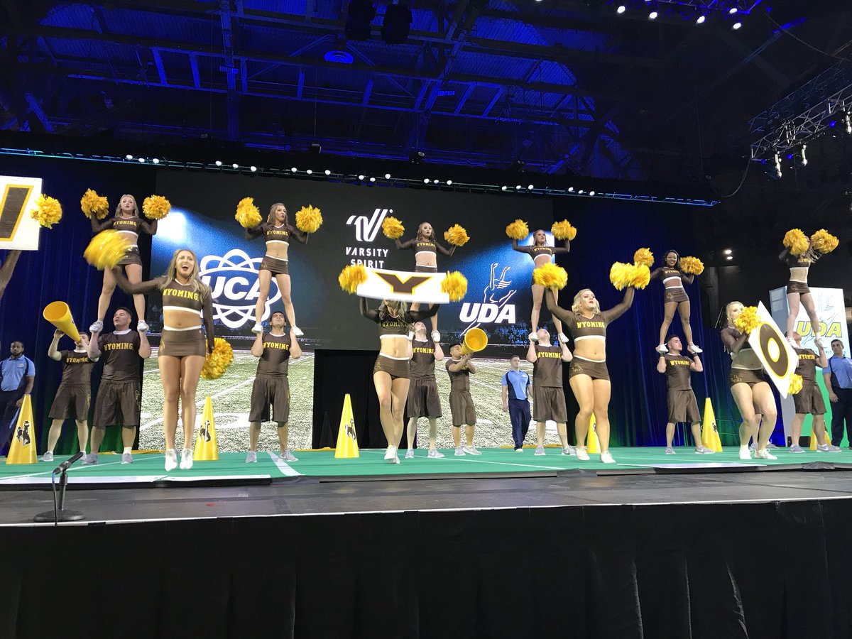UCAupdates's tweet photo. “Where did ya come from? Let’s Go Pokes!” Wyoming Coed came out with so much energy for their Game Day performance! 💛 #UCAnationals https://t.co/N69VUZDE0g