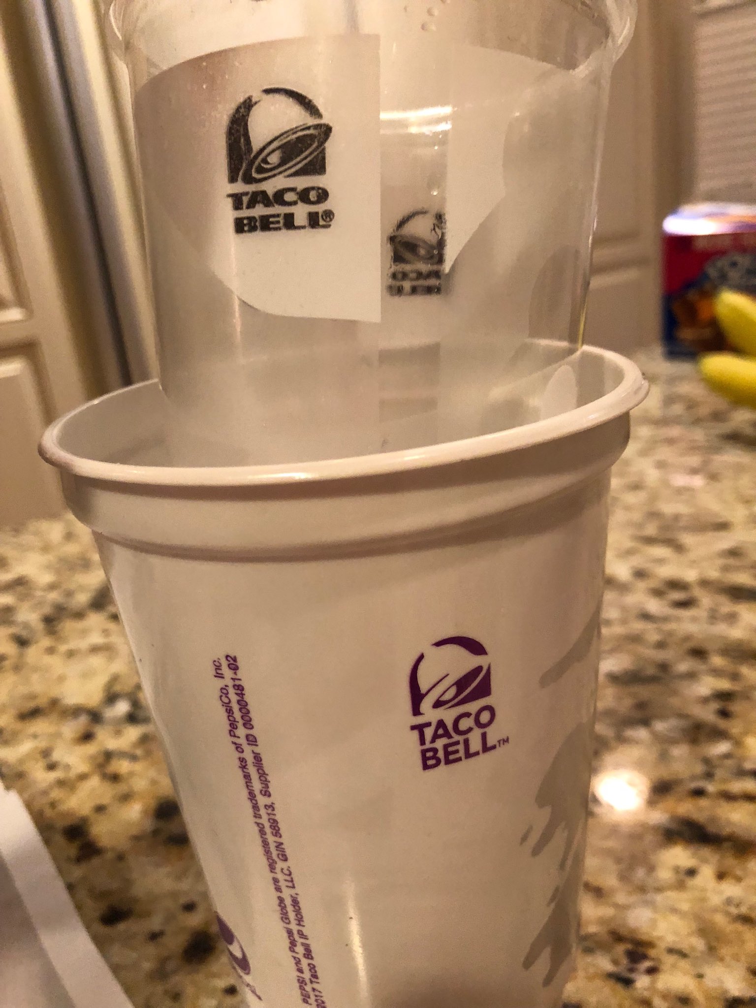 A comparison of the old style of clear Taco Bell drink cups (left