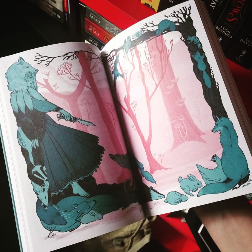 AkaWolf18's tweet photo. We're having a very misty, windy and rainy day and I'm browsing this pretty book #languageofthorns #leighbardugo #grishaverse https://t.co/Jq9VwOzZyo