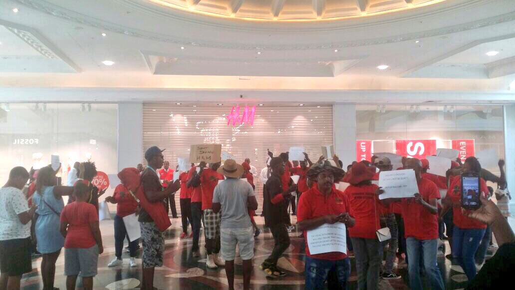 AthiMtongana's tweet photo. Happening right now in Century City, Cape Town. Protests outside the store, inside Canal Walk mall. #hmProtest #HM #hm @enca https://t.co/SI7S0qqq1A
