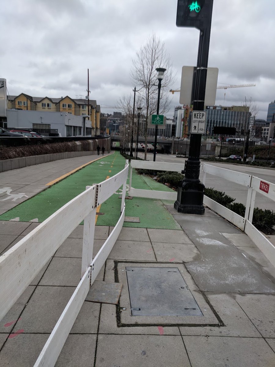 dongho_chang's tweet photo. Signal post relocation out of bicycle pathway at Mercer and Taylor. New utility cover installed at prior pole location. https://t.co/epHVbLXUT6