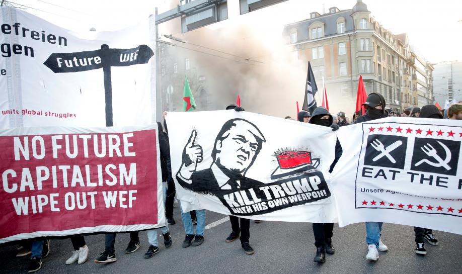 Reuters's tweet image. Anti-Trump demonstrators march in Swiss capital reut.rs/2DvOru1