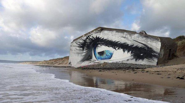 fubiz's tweet photo. Eye Street Art Piece on a French Beach https://t.co/ow50646235 https://t.co/zHkl1jUCvI