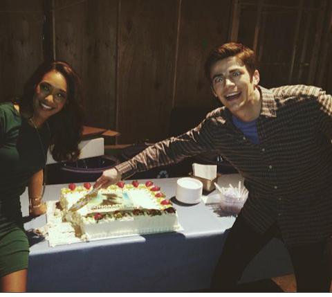 Here you can see a silly-looking Grant Gustin and Candice Patton murdering a cake. Happy Birthday  