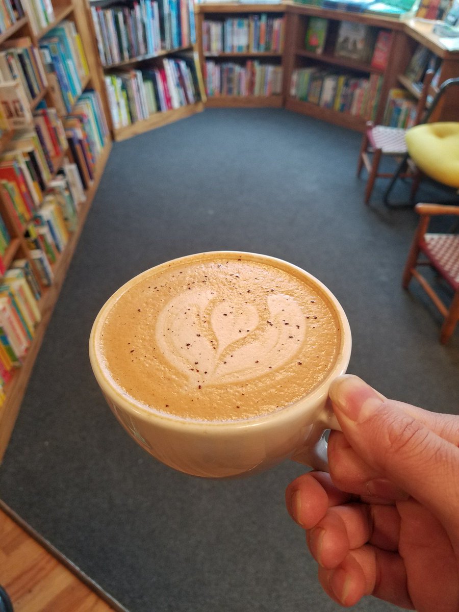 A <a href="/literaticoffee/">Literati Coffee</a> Mocha latte amongst children's books. Know a little person who might like this setup. #AnnArbor #coffee #visitannarbor (@ Literati Coffee in Ann Arbor, MI) swarmapp.com/c/gnJPjWp1Q7j