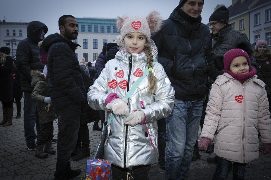 People collect money for the medical care of sick children and geriatrics during the annual Grand Finale organized by the Great Orchestra of Christmas Charity Foundation, the biggest non-governmental charity organization in Poland