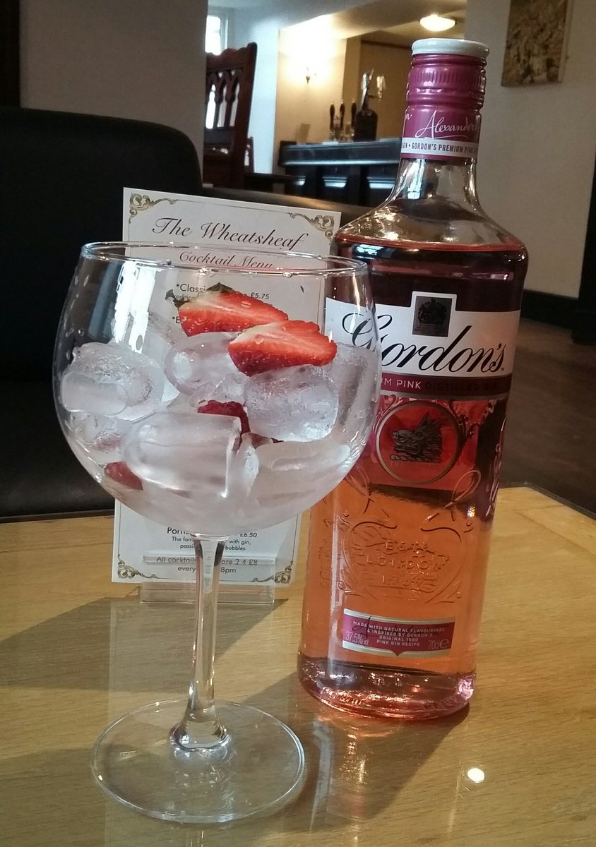 Gordon's Pink Gin &amp; Tonic served over ice, garnished with fresh strawberries 
#Ginuary