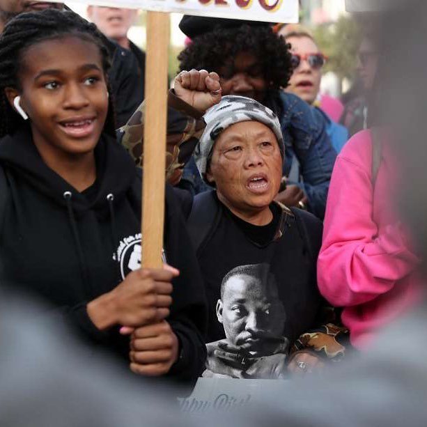 SFGate's tweet image. From Instagram: Mercy Wong (center) marches down 4th Street on Martin Luther King, Jr. Day in San Francisco, Calif., on Monday, January 15, 2018. 📷: @scottstrazzante #mlkweekend #mlkday2017 #mlk #mlkday ift.tt/2Ddgilu