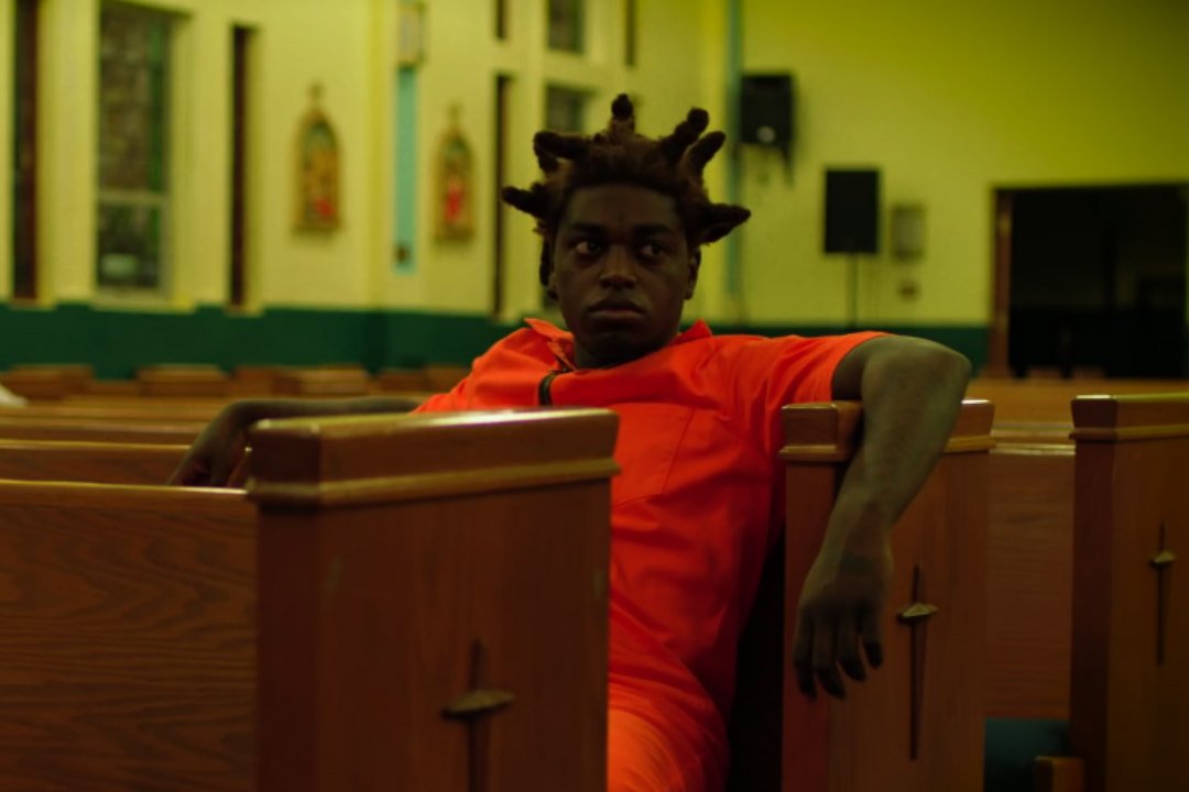 XXL's tweet photo. .@KodakBlack1K visits church in prison jumpsuit in "Roll in Peace" video https://t.co/RIcnvr5xjq https://t.co/IGtguzhLFQ