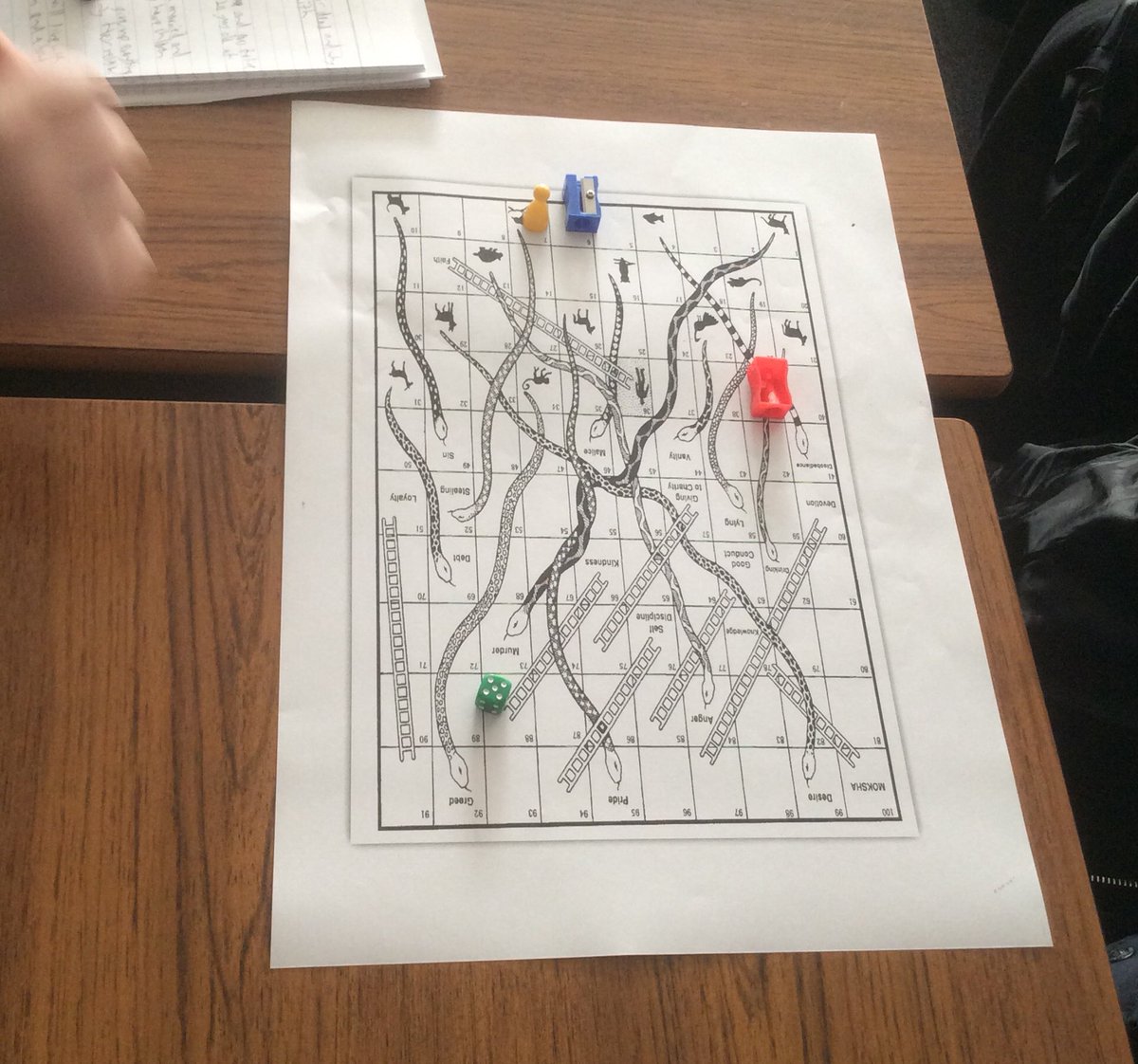Samsara-a game? Year 11’s learning about Hindu reincarnation through a game of Snakes and Ladders.