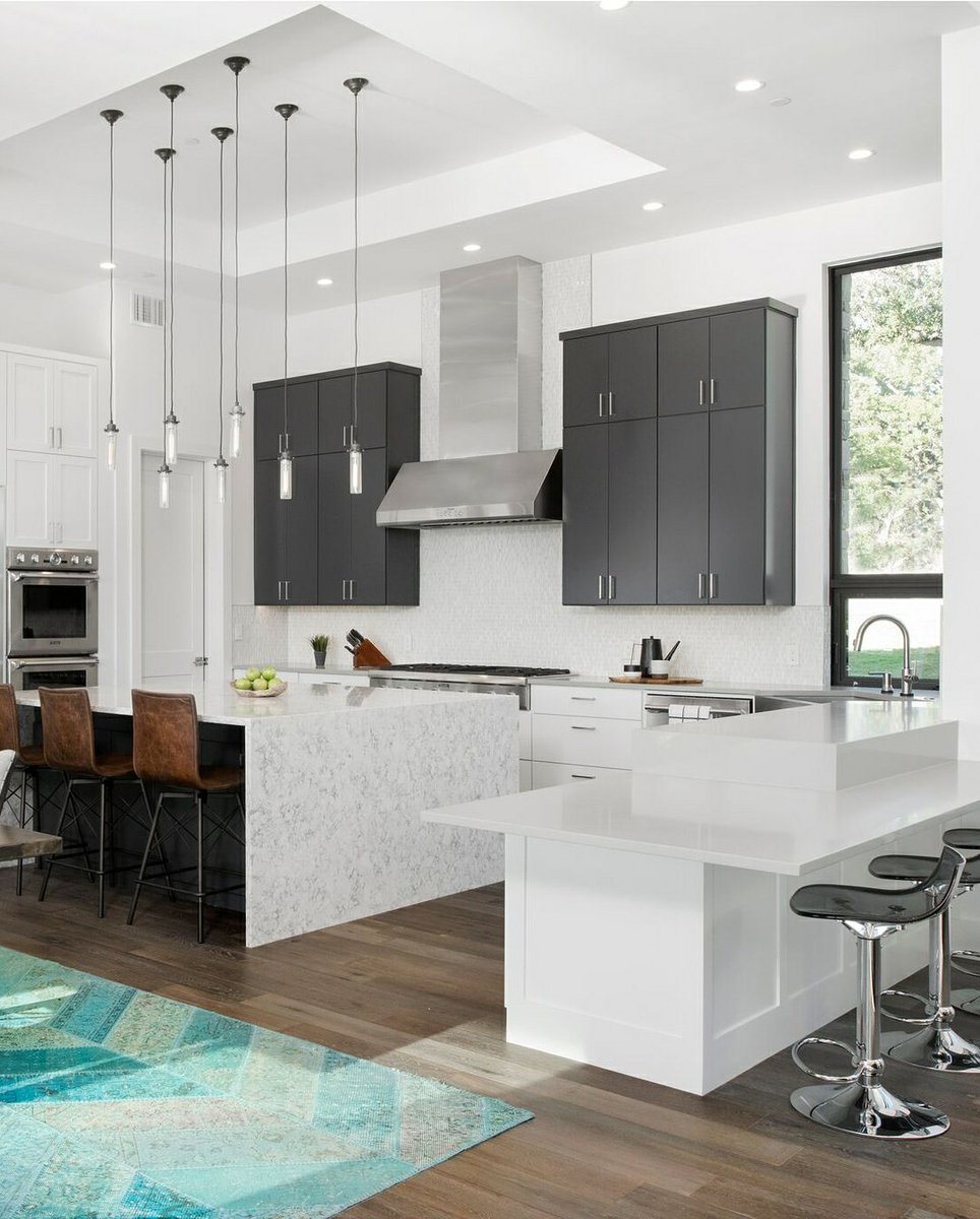 The neutral tone of all the finishes are integrated so well without any overwhelming components. The elegant veins on the waterfall counter-top acts as a nice accent to the kitchen. 
Featured design: Rococo
lgviaterausa.com