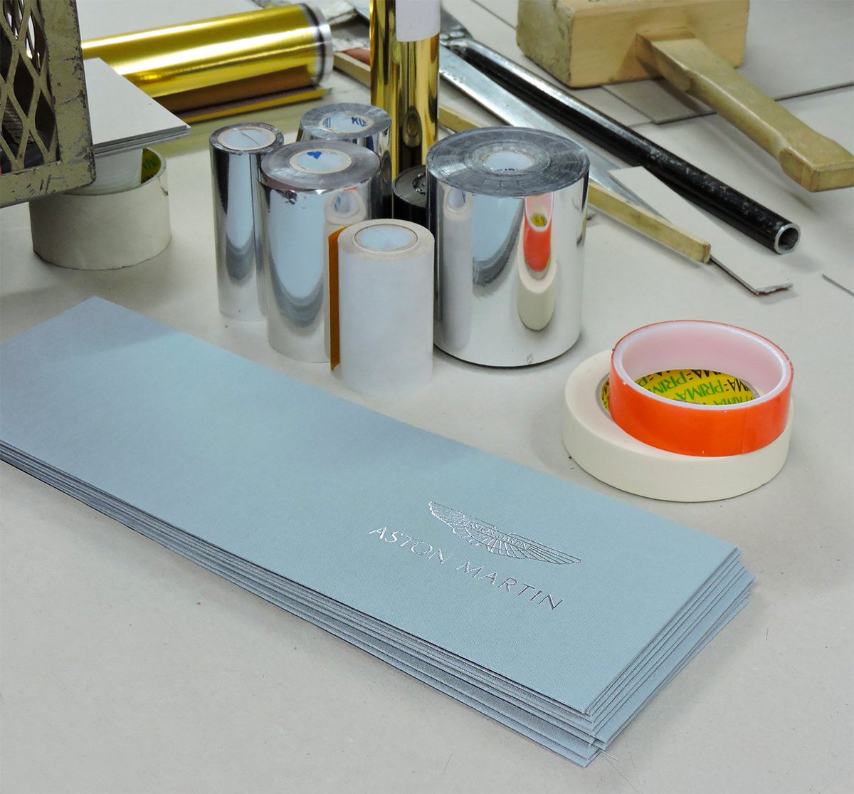 PelicansGroup's tweet photo. EMBOSSING or DEBOSSING is a stamping process of creating either raised or recessed images in the leather in blind, silver, gold or any other colour. Aston Martin is choosing silver foil to compliment the beautiful light blue background. #bespoke #branding #embossing https://t.co/ATSmffxaFU