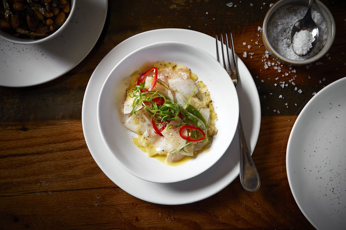 Take your tastebuds on an adventure with our fluke crudo | shaved black radish, pickled chilies, scallion vinaigrette. #ChicagoFood #DMKRestaurants