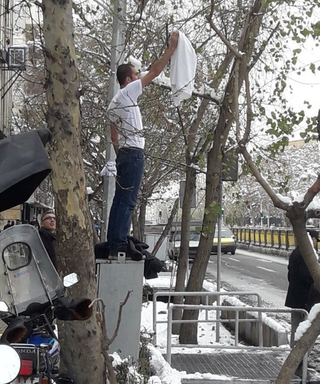 Compulsory veil is an injustice and an insult to Iranians' intelligence. This man was waving a white flag today in Iran. Although he doesn't have to wear the compulsory veil, he feels for women who are obliged to wear it. 
#WhiteWednesdays