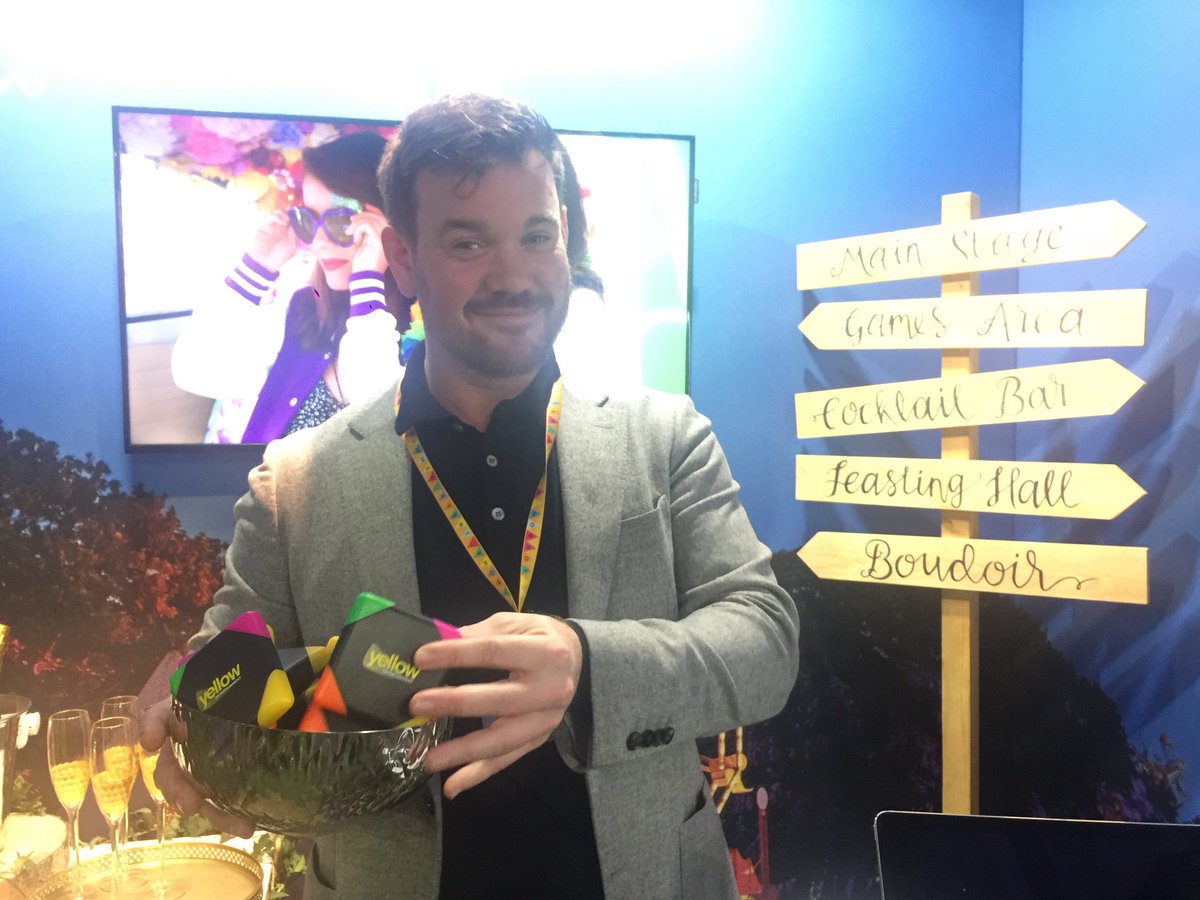Yell_Ent's tweet photo. Our lovely Tom modelling the new Yellow branded merch! At @LadySummerSkye last week. Such great fun and our pens were popular! 😉 #LSES2018 https://t.co/laxv7cYF6h