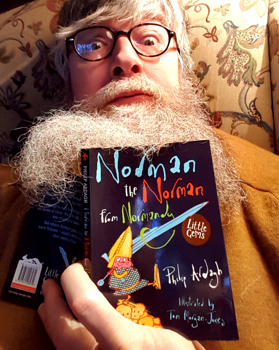 PhilipArdagh's tweet photo. Not many people know that my beard is tidal. Here it is washing over a copy of NORMAN THE NORMAN FROM NORMANDY. When the beardal tide goes out, people often assume I've had a bead-trim. #beards #tides #pullofthemoon https://t.co/JuJoXEMjno
