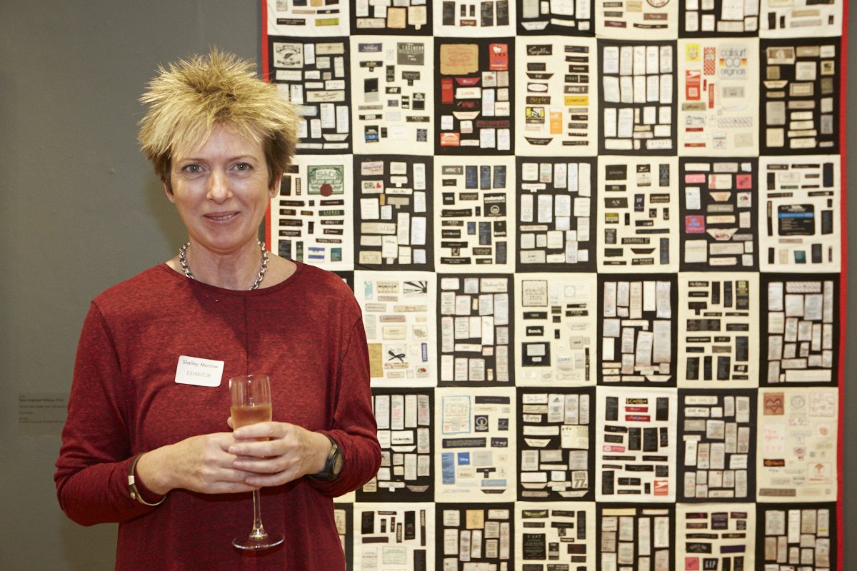 mallgalleries's tweet photo. Do not miss the #ArtTextile by Shelly Morrow #whomademyclothes at #ColumbiaThreadneedlePrize: a patchwork blanket with 1,138 used clothes labels sewn on. The number of labels is representative of the number of people who died in the Rana Plaza complex, Bangladesh in 2013. https://t.co/BZhyVVcDiH