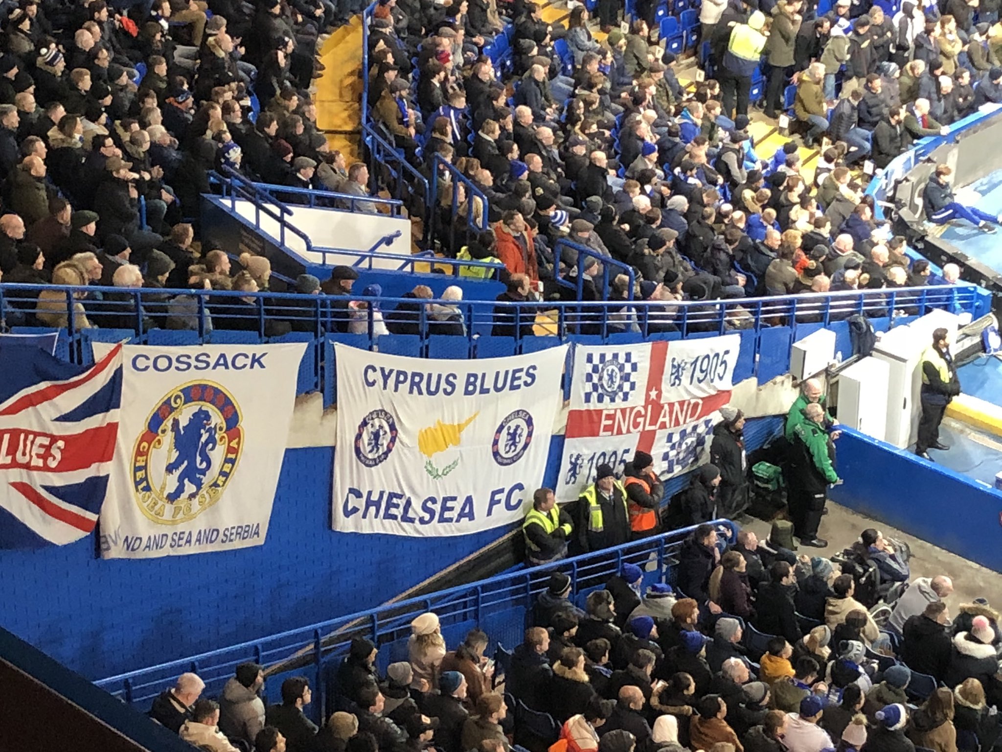 General view of Chelsea fans in front of a 'Cyprus Blues' banner