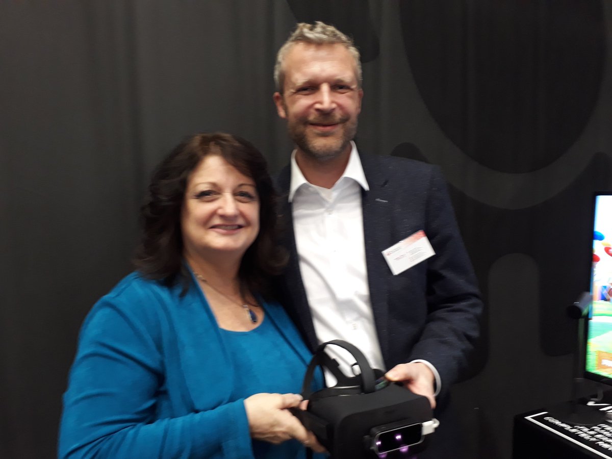 Factor_Six's tweet photo. Our CEO Holger together with the renowned toy expert @ToyTrendExpert Reyne Rice. Thanks for your feedback on our #VR game for the elderly. #Spielwarenmesse #toys https://t.co/ETqFLcMzxN