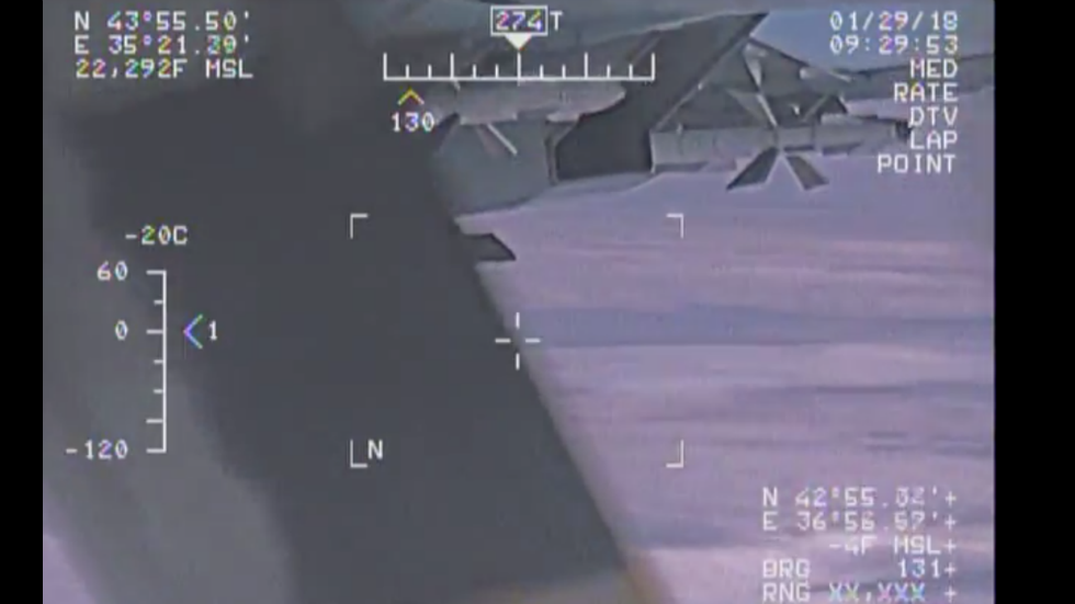 thehill's tweet photo. Navy releases five more videos of Russian jet flying within 5 feet of US Navy plane https://t.co/H6RjG45EFA https://t.co/bsqYeq9qJu