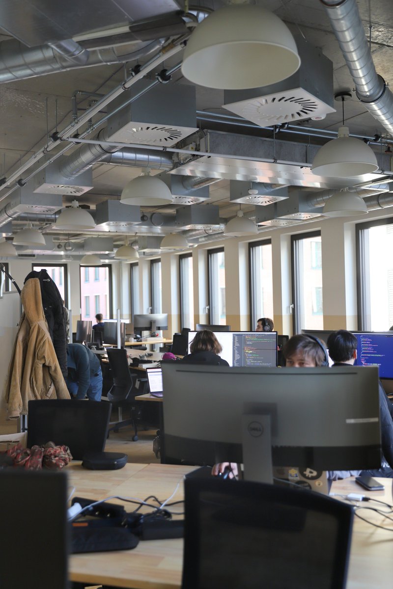 Lisk's tweet photo. 🚚📦🏢 After this morning's move to a new #WeWork location, our #devs are straight back to it! #Lisk https://t.co/mMtc4HY9Gk