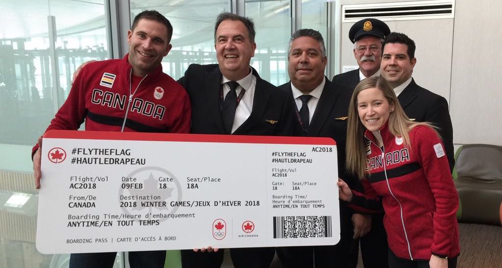 CurlingCanada's tweet photo. A big thanks to @AirCanada for sending @LKLawes and @johnnymocurler off in style on their journey to #PyeongChang2018 for the first Olympic mixed doubles #curling competition! #flytheflag #gocanadago @TeamCanada https://t.co/C4S8QKLG7A