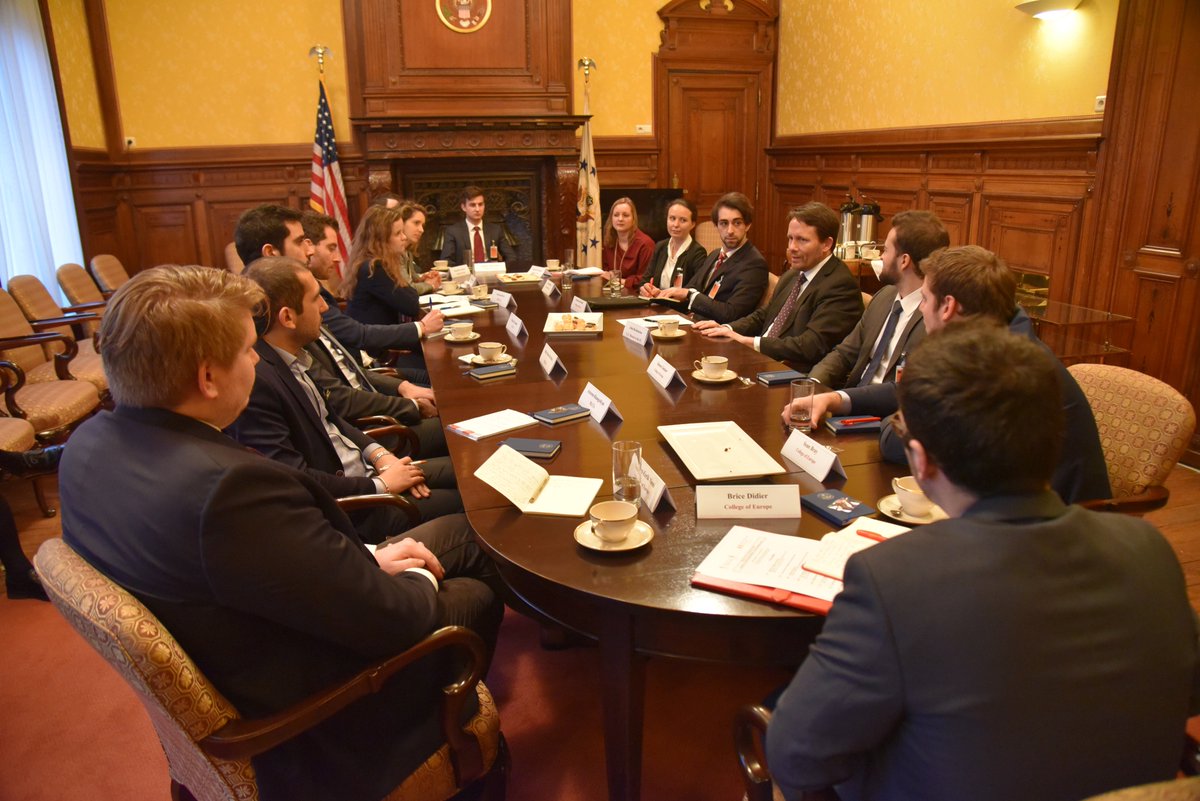 Students from the College of Europe and Fletcher School's joint Master in Transatlantic Affairs program listen to an USEU officer at a briefing at the US Mission to the EU.