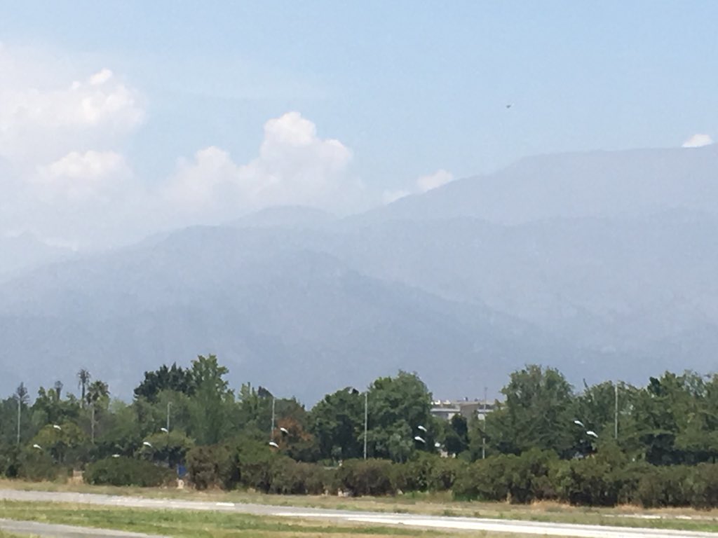 faisgp's tweet photo. Little hazy today... the first ridge they will be climbing on... launching just finished. Gliders climbing up slowly #faisgp #race6 underway soon.... ENJOY! Watch at https://t.co/wUXvZ8UE59 https://t.co/TEJzqQPXKd