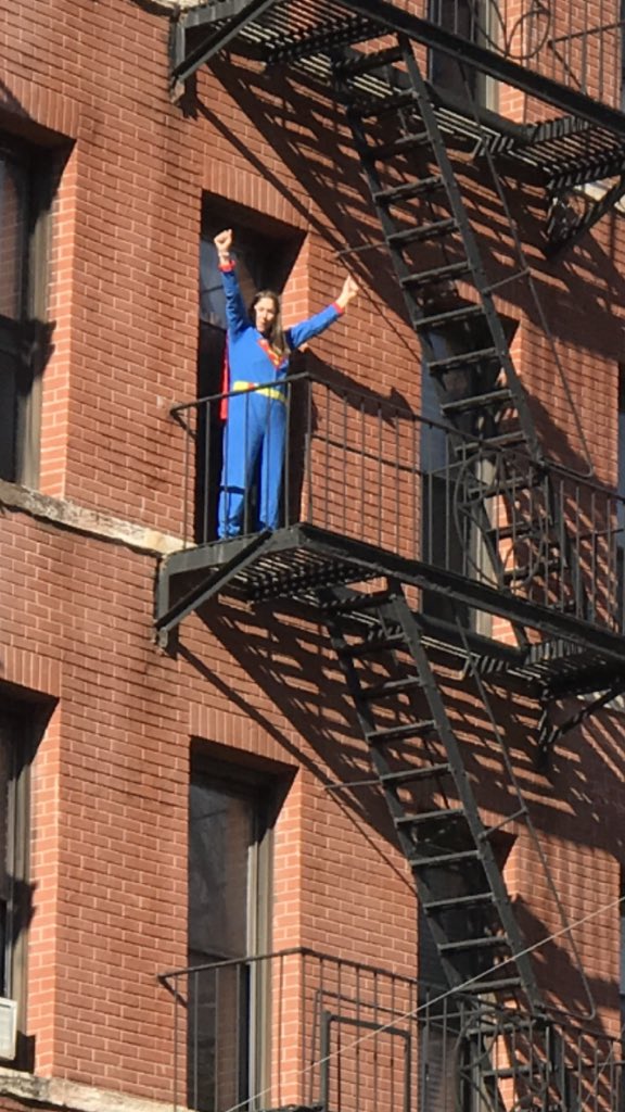 sadmonsters's tweet photo. That awkwardly symbolic moment when you're a dude in your underwear who thinks the Women's March is cheering for you, but they're actually cheering for Supergirl two fire escapes above https://t.co/tXttIQdQiX