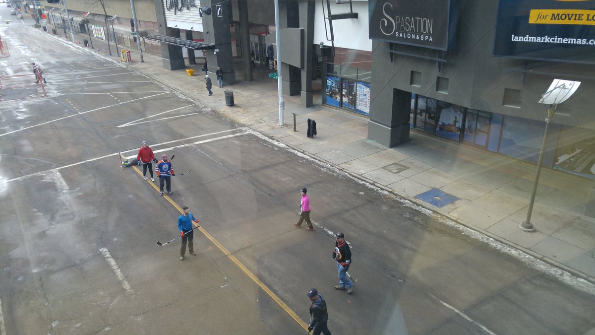 Edmonton2018's tweet photo. Just a typical Saturday afternoon in downtown Edmonton.... Impromptu street hockey game! https://t.co/Y0rl3baN2U