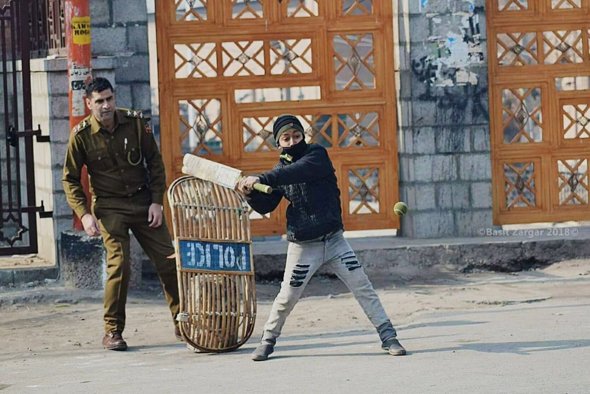 Many shades of khaki. A rare picture capturing the spirit of the street at # Nowhatta #Srinagar .@JmuKmrPolice