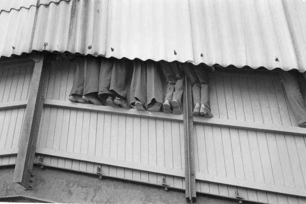 1970's football fans watch game without paying.