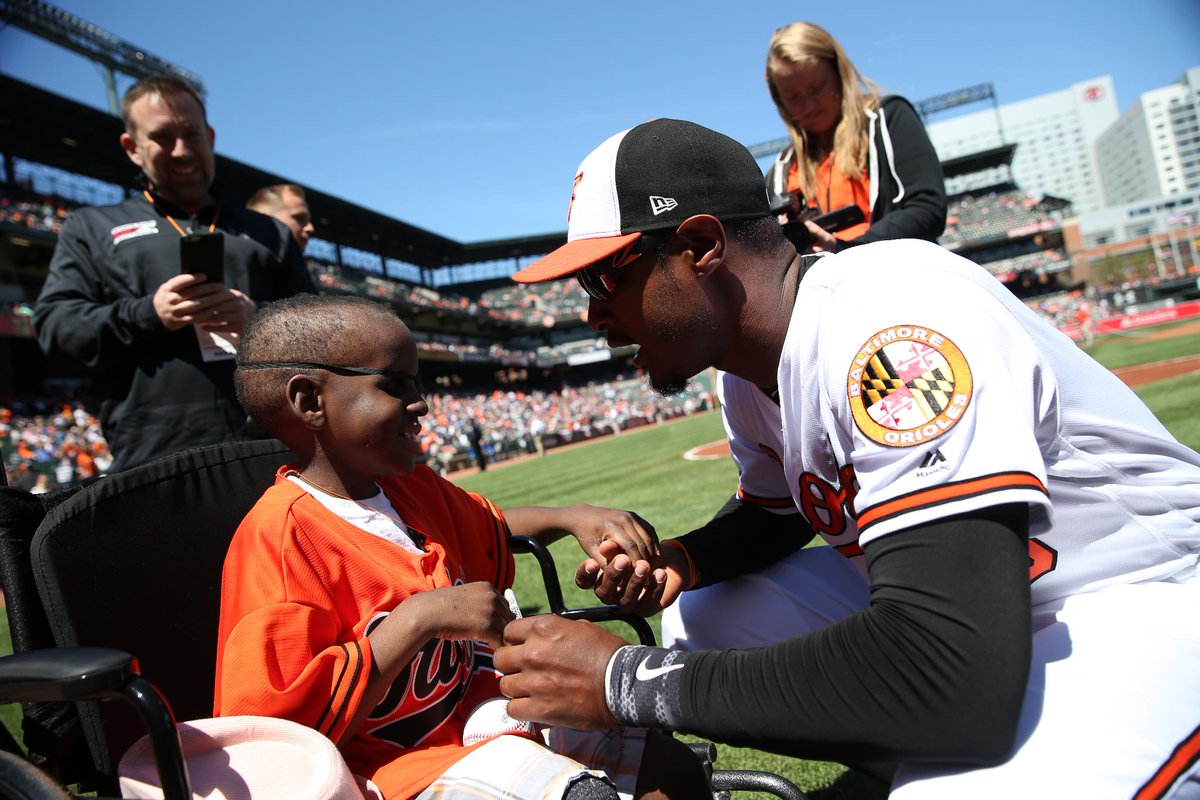 Orioles's tweet photo. #OsThrowback to #Orioles super fan Mo Gaba & @SimplyAJ10 exchanging a pregame hug. #NationalHuggingDay https://t.co/pSKFAbfj7A