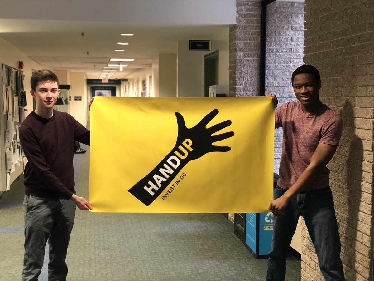HandUpGW's tweet photo. Hand Up Founder and President Emmanuel Sessegnon and E-board  member Nathan Higgins with our new banner! #HandUp #InvestinDC https://t.co/YndQTV78Ju
