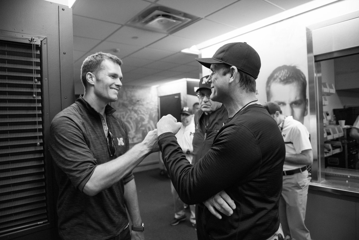 Tom Brady-heading to the Super Bowl! Being congratulated by friend and fellow Wolverine great quarterback Jim Harbaugh before a Michigan game. ©David Turnley, @CoachJim4UM