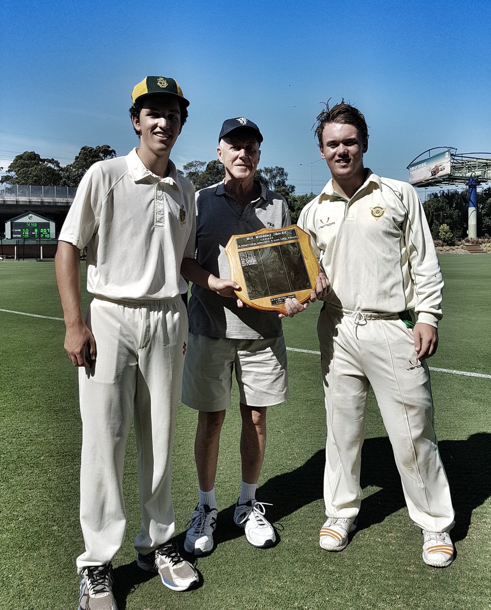 StKevinsCricket's tweet photo. Captains of St Kevin's and St Patrick's, Jack Di Stefano and Jake Williams, with Br Bill Wilding, the man after whom the Launceston-bound Wilding Shield is named. #skcsport #apssport #erea https://t.co/cQqpzl0okM