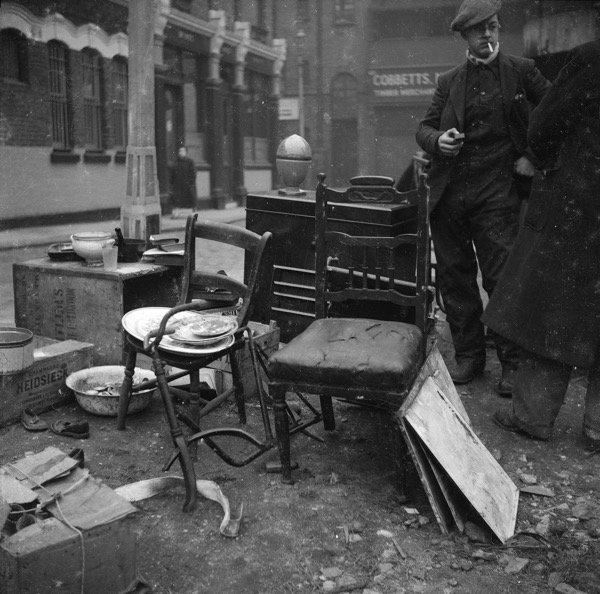 Junk market off Virginia Rd BethnalGreen back of Leopold Buildings. Front of building was on Columbia Road- Market took place on the bomb site at the back of the flats local kids played cricket there in the early fifties on summer evenings Nigel Henderson’s EastEnd @thegentleaur