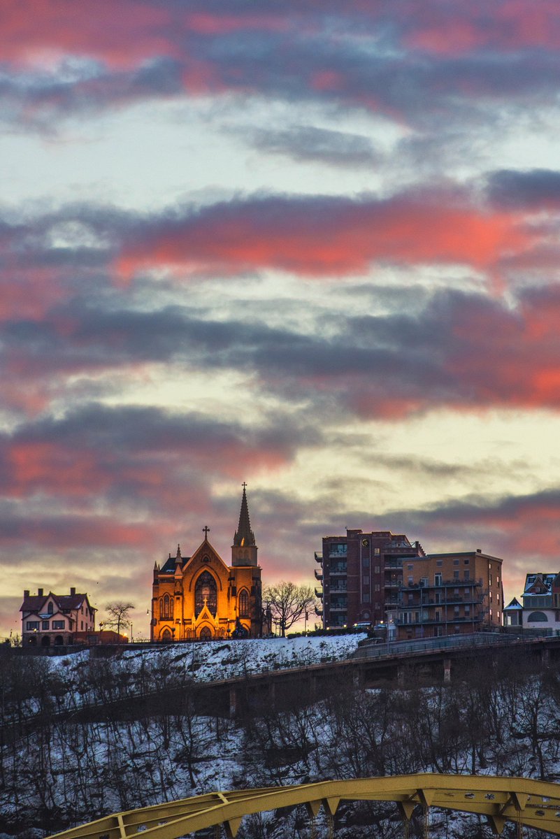 DaveDiCello's tweet photo. A cotton candy sky provides a beautiful backdrop for St. Mary of the Mount on top of a snow covered Mt. Washington in #Pittsburgh during a spectacular winter sunset https://t.co/BptieQh1jR