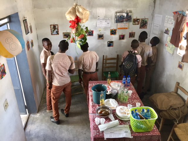 StTimsRaleigh's tweet photo. On their first day, our team in Haiti served lunch to the children and spent time playing with them. They hung photos they brought from last year's trip, and the children enjoyed seeing them. It was a great first day at St. Timothee's School! https://t.co/3ggcniGQQr