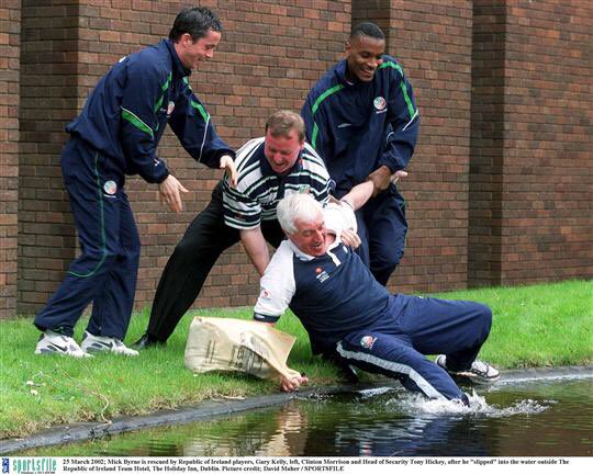 irish_pics's tweet photo. Gary Kelly, Head of Security Tony Hickey and @morrisonclinton help Mick Byrne after he “slips” at the Irish team hotel in March 2002 #CallingShenanigans https://t.co/wAKkFvciGg