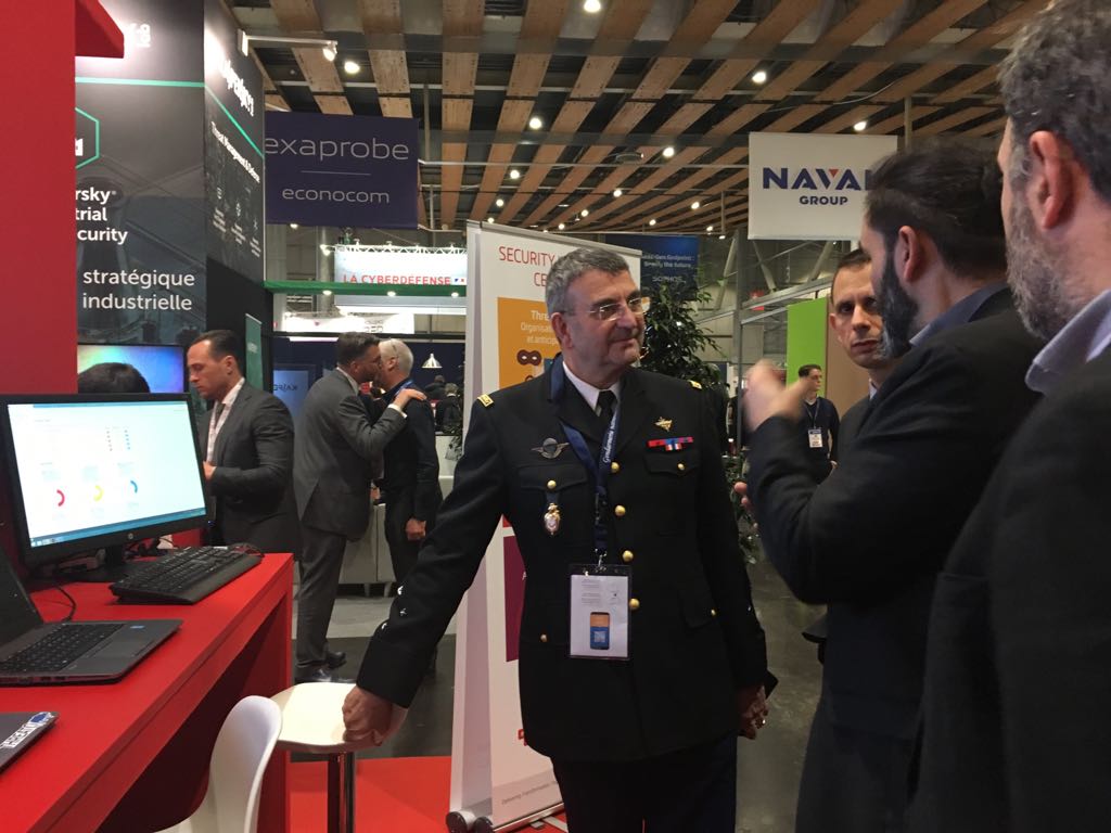 SopraSteriaSecu's tweet photo. Sopra Steria shows the power of the Security Intelligence Center to General Poirier-Coutansais, head of #STSI2. #FIC2018 https://t.co/7n15L4OQo5