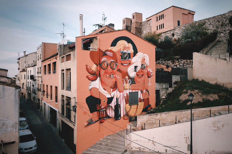 Catalan artist <a href="/marinacapdevil4/">marinacapdevila</a> (globalstreetart.com/marinoart) has created this ode to her home town, #Falset. The piece represents the key features of the town: wine, tourism &amp; local trade. 
—
What would you paint if you were showing off your home town? 
—
#streetart #art