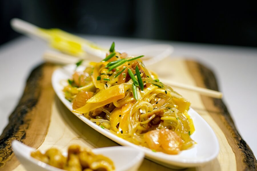 “A mouth-watering combination of potato noodle, green mango, green papaya, lemongrass, lime, pomelo, Thai basil, tempeh, toasted black &amp; white sesame seeds, infused with our sesame soy vinaigrette will sure be a crowd pleaser!” – Executive Chef Richard Andino, <a href="/Encore_Catering/">Encore Catering</a>