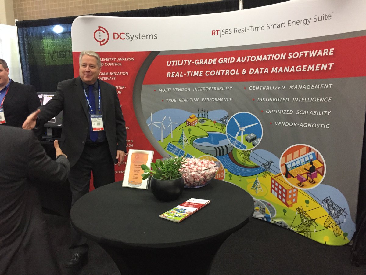 RTSmartGrid's tweet photo. Nobody high fives like Doug Campbell! Join us as we turn this display on its side and use it for a trampoline, starting at 4pm :) Booth 3013 #DTECH2018 https://t.co/ktRiZKfOMb https://t.co/RmquZfN0uG